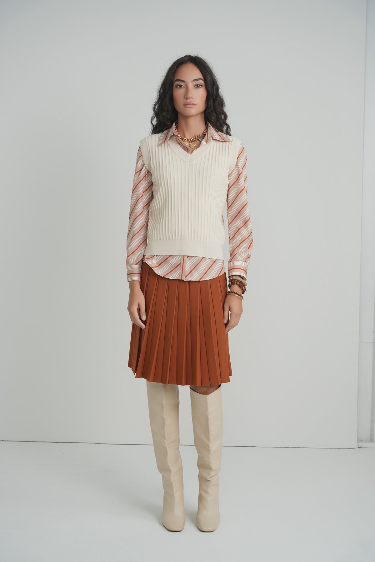Pleated Wonder Skirt in Pumpkin – on model – ALEEZA PARIS