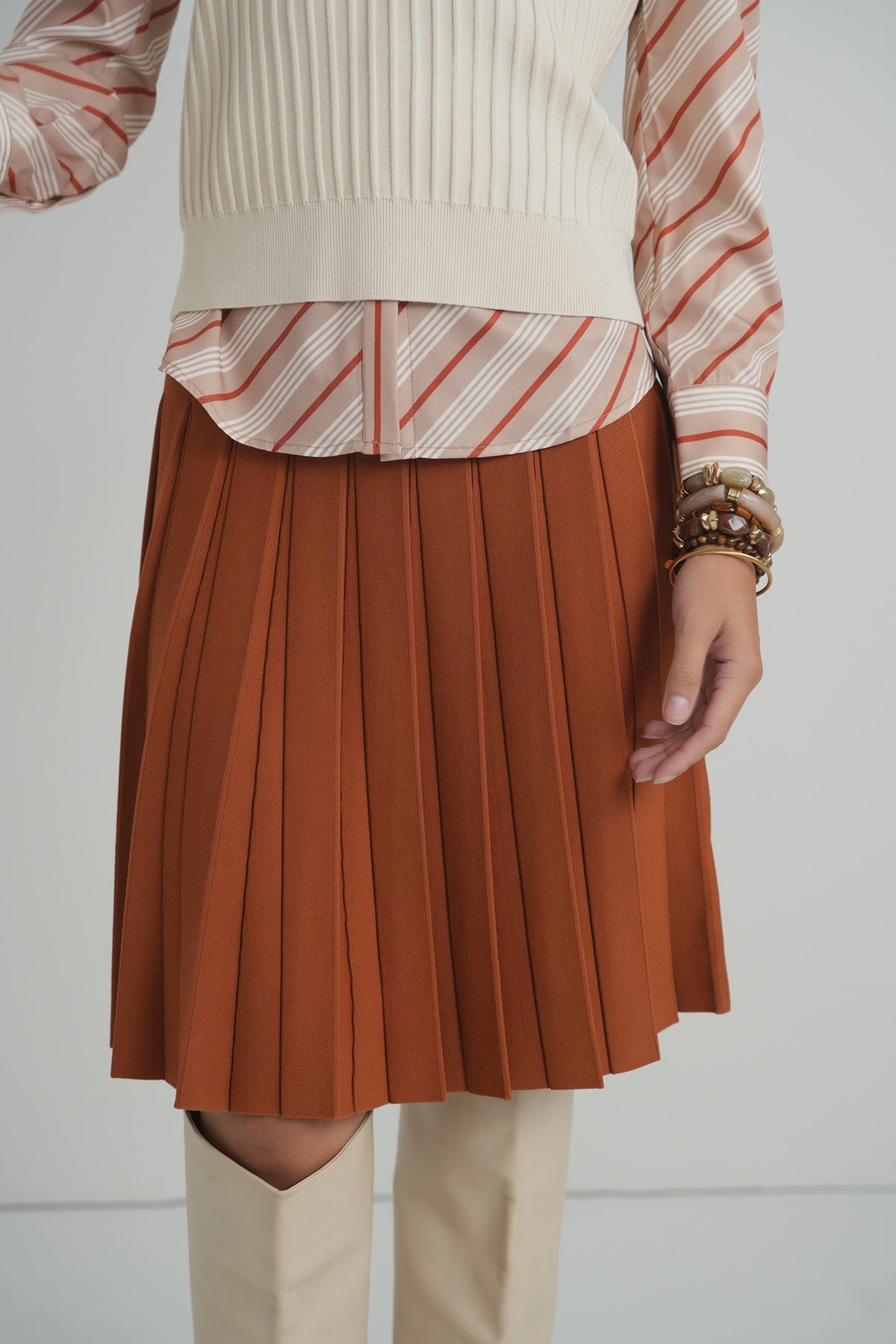 Pleated Wonder Skirt in Pumpkin – on model – ALEEZA PARIS