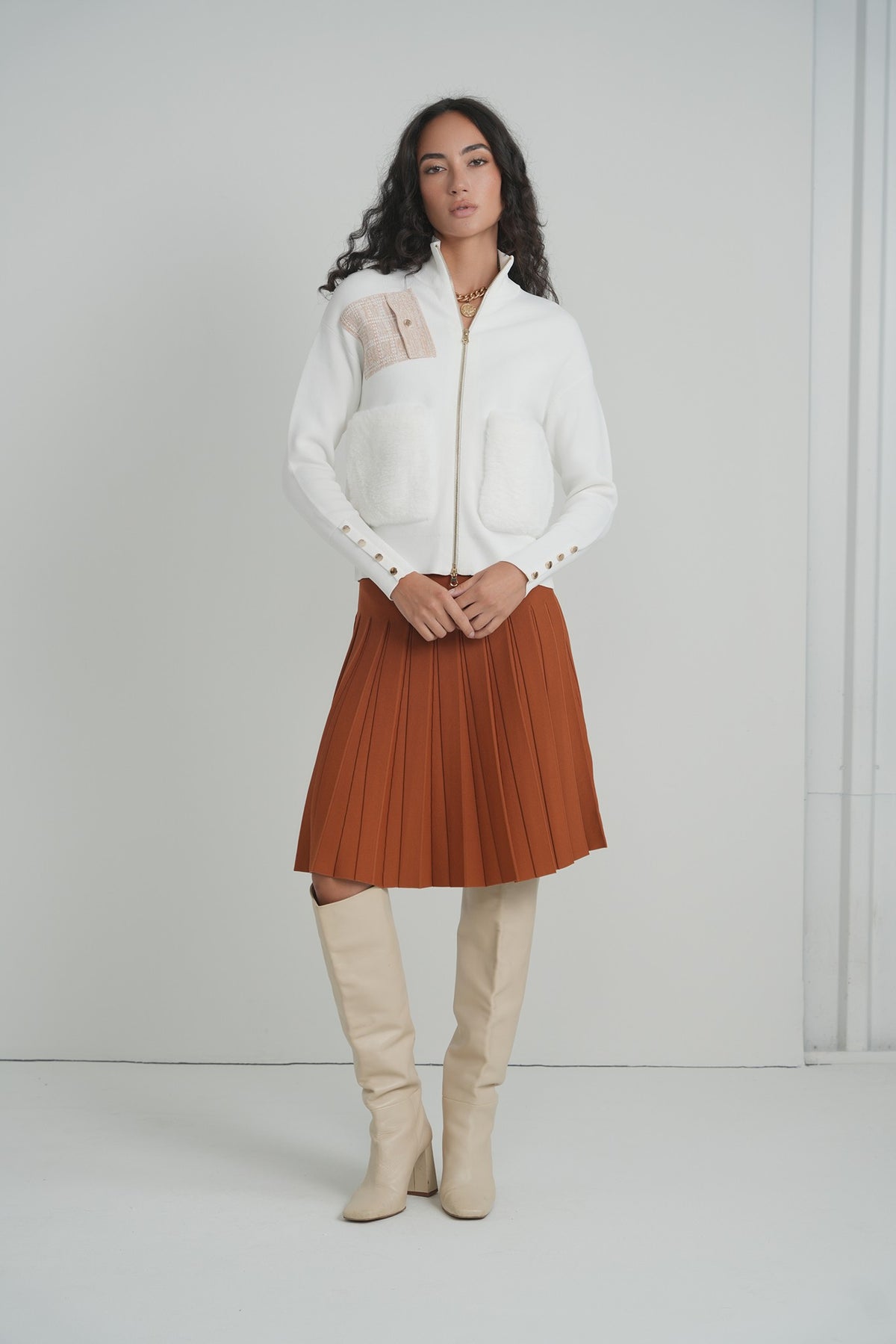 Pleated Wonder Skirt in Pumpkin – on model – ALEEZA PARIS