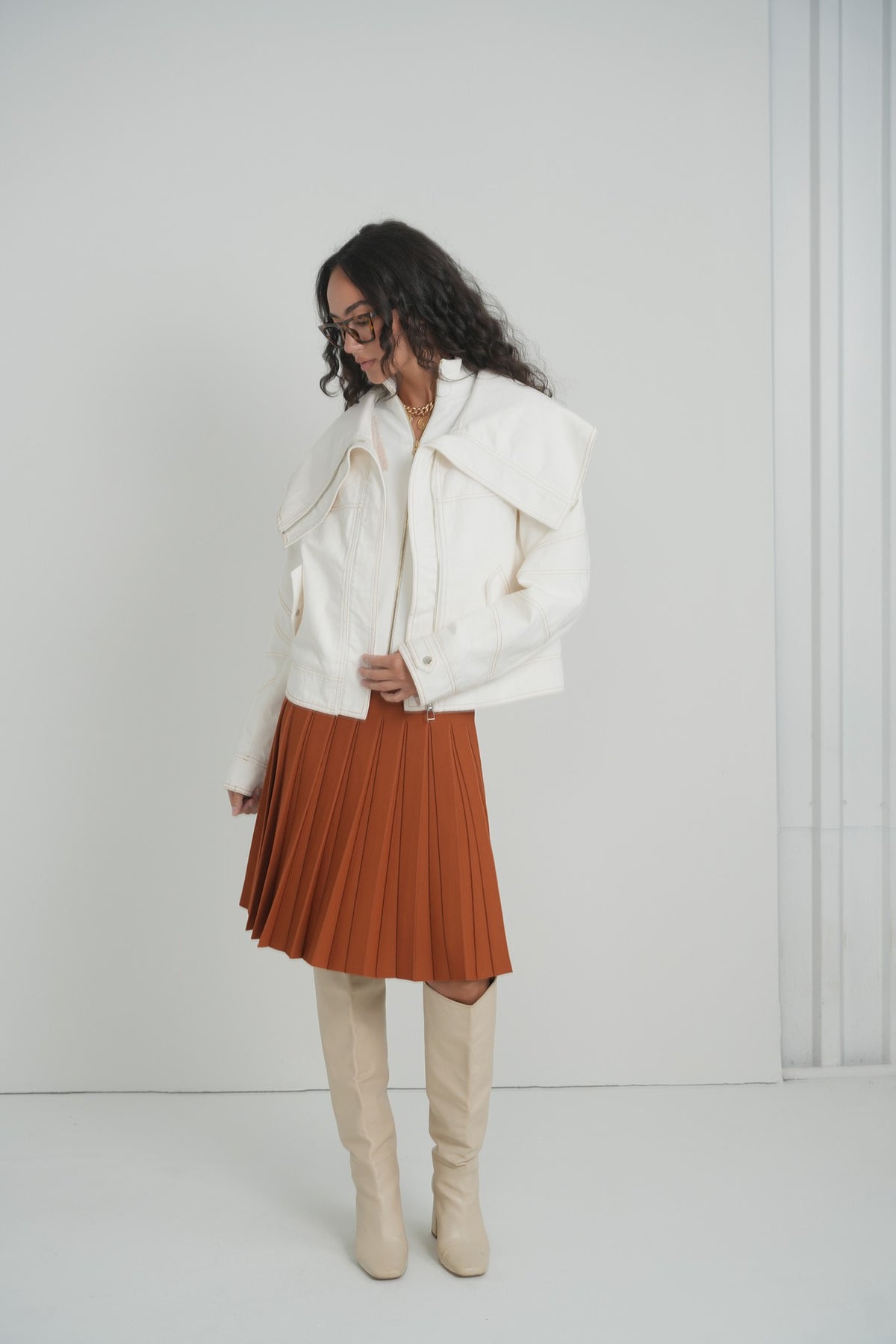 Pleated Wonder Skirt in Pumpkin – on model – ALEEZA PARIS