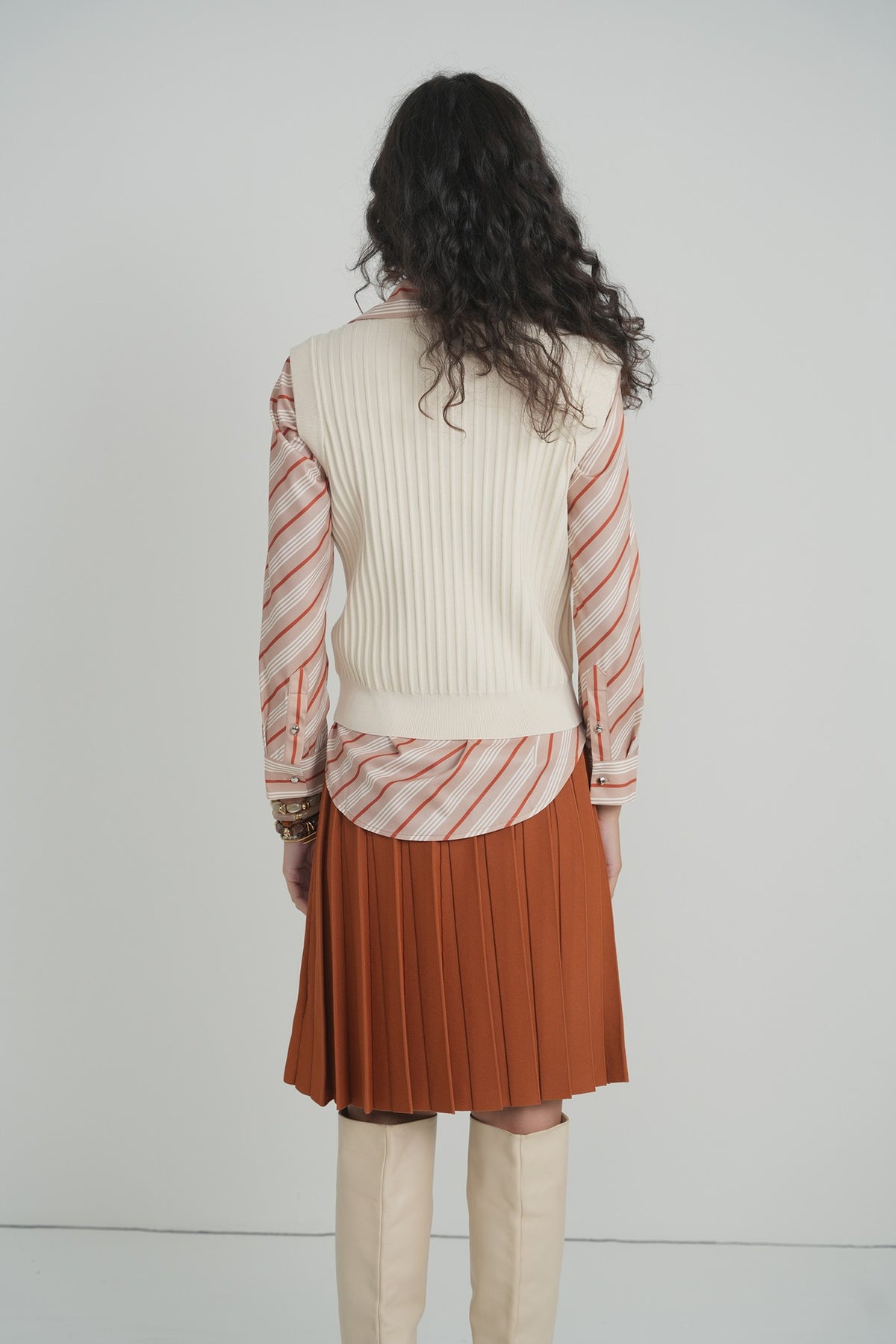 Pleated Wonder Skirt in Pumpkin – on model – ALEEZA PARIS