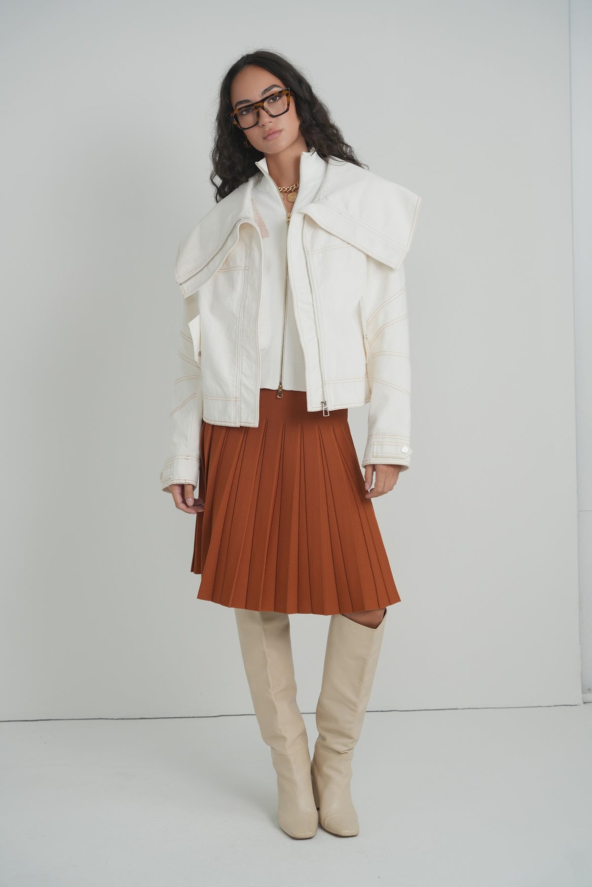 Pleated Wonder Skirt in Pumpkin – on model – ALEEZA PARIS