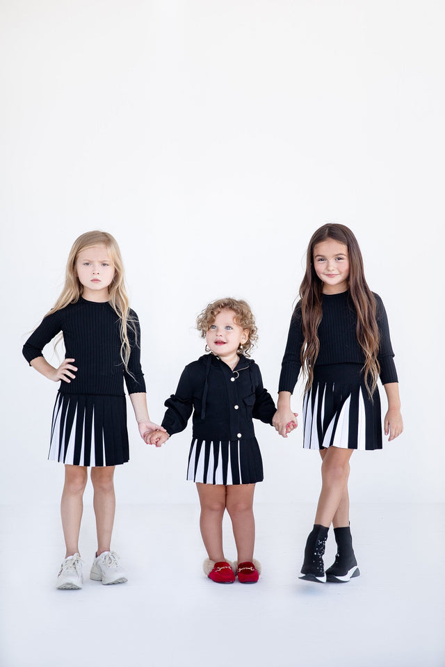 Black Ribbed Knit Top And Black And White Knit Skirt